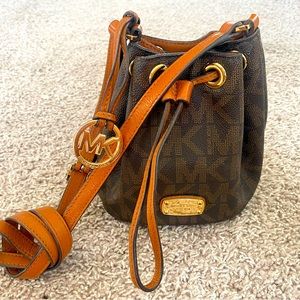 Leather Michael Kors cross body draw string bag